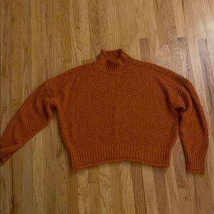 Vibrant Orange Turtleneck Sweater with Chunky Knit